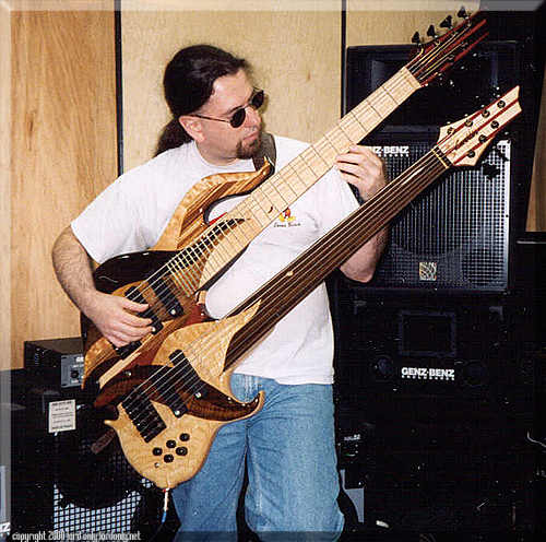 John plays his doubleneck Conklin 7-string at the Genz Benz booth at the '99 Winter Namm show